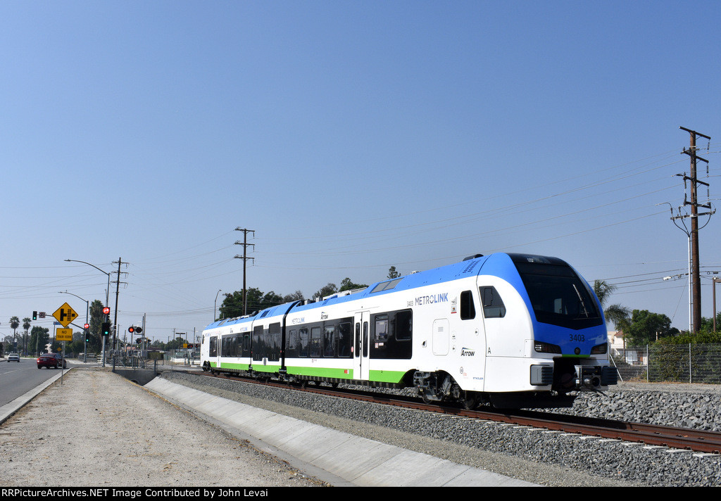 An eastbound heading to Redlands-University Station after crossing W. Colton Avenue at grade 